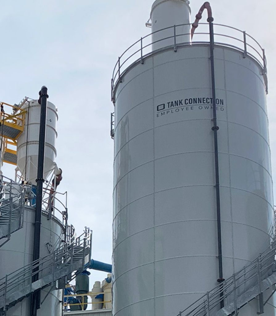 Industrial storage tanks at a Nichiha manufacturing facility