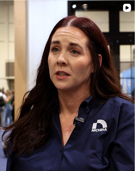 A Nichiha team member speaking on camera at an industry trade show