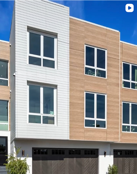 Townhomes clad in white and wood-look Nichiha fiber cement panels