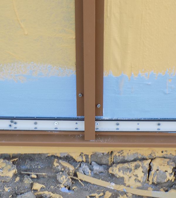 H-Mold in Cedar being installed on a wall