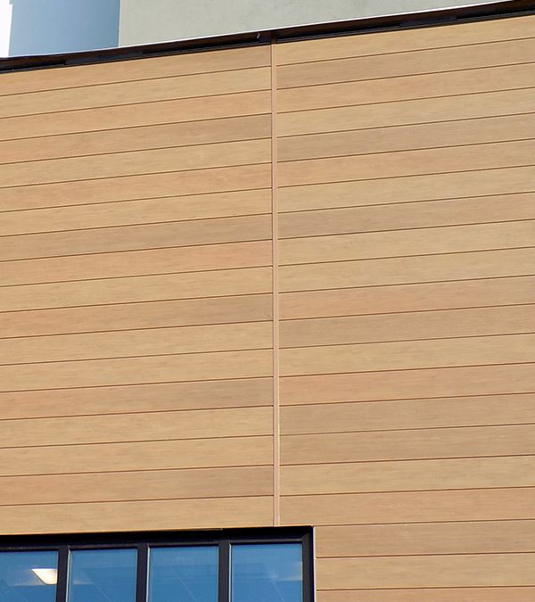 Powder coated H-Mold installed on a building to match VintageWood