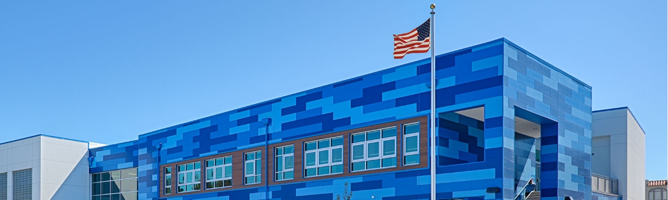School exterior with blue and white wall panels