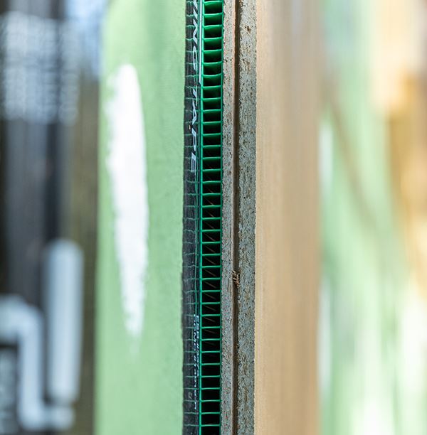 corrugated shim installed on wall
