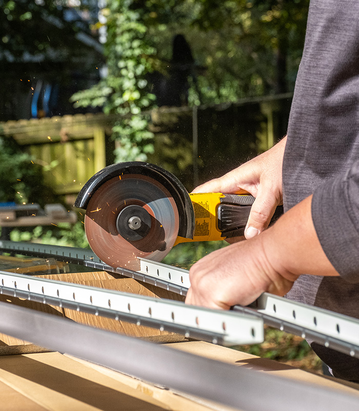 horizontal starter track being cut in the field with a handheld saw