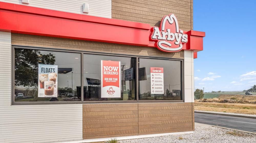 This Arby&rsquo;s fast-food restaurant utilized Nichiha paneling. There are three signs hanging on the windows, one advertising their floats, one advertising that they&rsquo;re hiring and the other advertising their health strategy.