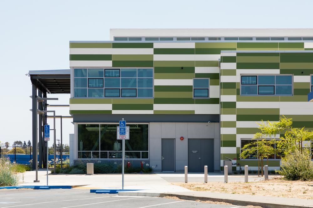 Mount Eden High School in California utilizing Nichiha&rsquo;s green and white exterior cladding panels.