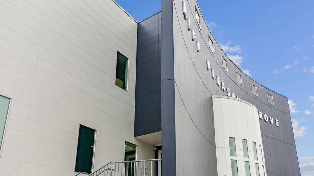Kipp Pleasant Grove Middle School close-up of Nichiha&rsquo;s fiber cement cladding from their Illumination series in blue and white.