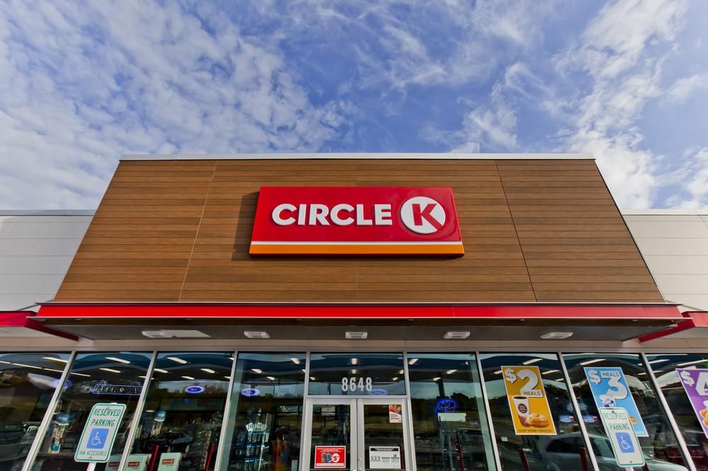 A close-up of the Circle K convenience store logo in red and white with Nichiha’s fiber cement cladding in brown behind it in San Antonio, Texas.