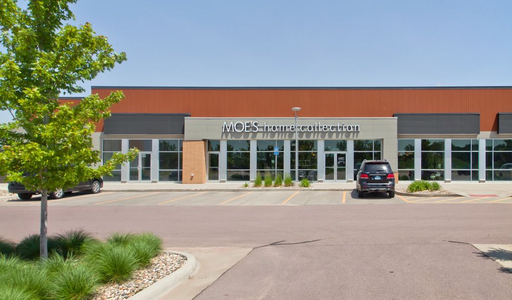 A close-up of the strip mall at South Lorraine Place. Moe’s home collection storefront utilizes three different textures of Nichiha’s fiber cement cladding.