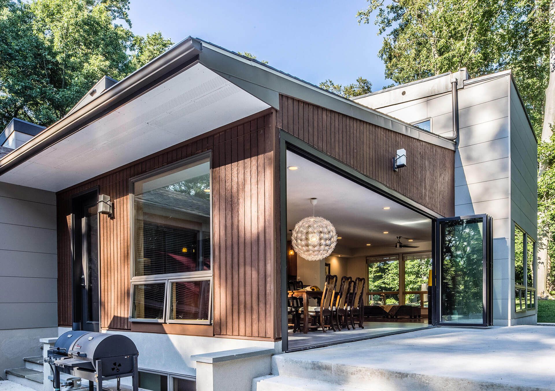 Modern home clad with weathered real wood and Nichiha&rsquo;s ArchBlock panels in Gray