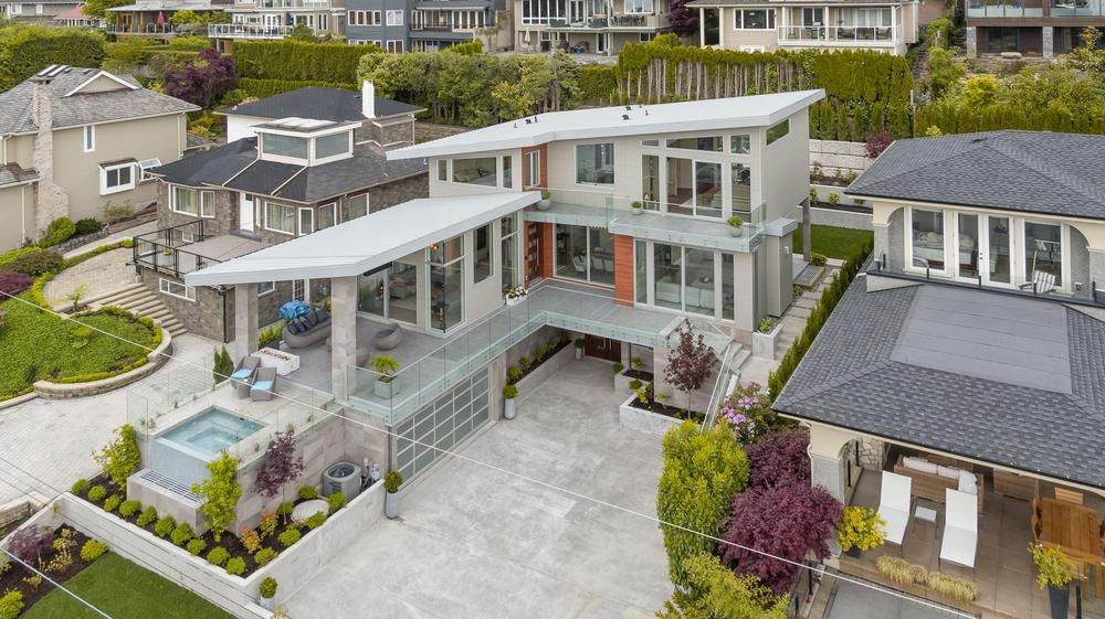 A house with Nichiha fiber cement siding and large amounts of glass windows.