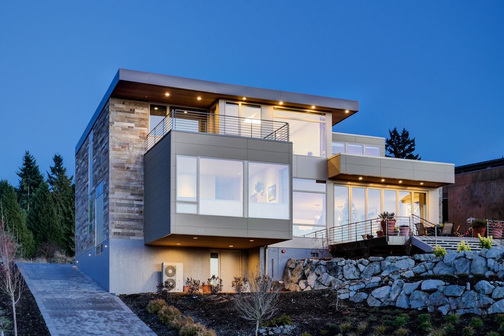 A home with brick-aesthetic fiber cement siding from Nichiha at dusk.