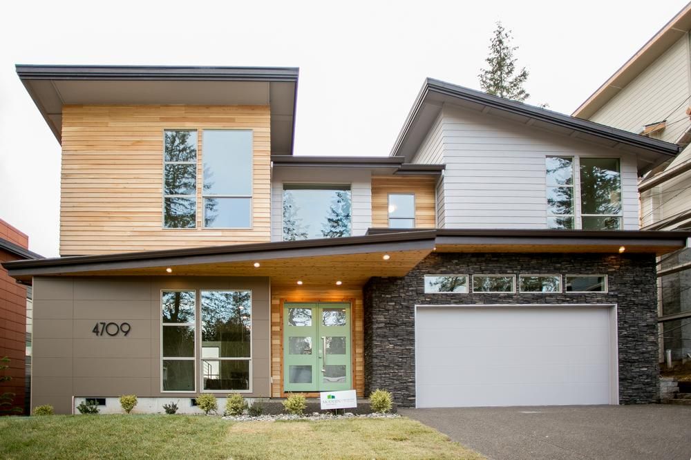 A two-story home with varying siding materials. The bottom right features Nichiha Architectural Block fiber cement siding in Mocha.