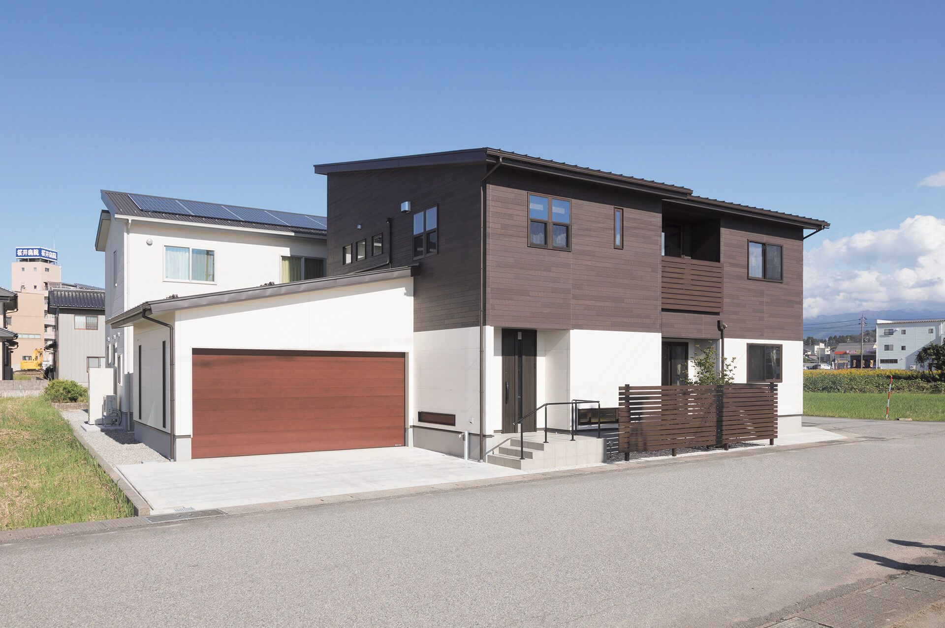 Modern home in Japan featuring Nichiha&rsquo;s dark faux wood fiber cement panels RoughSawn in color Espresso