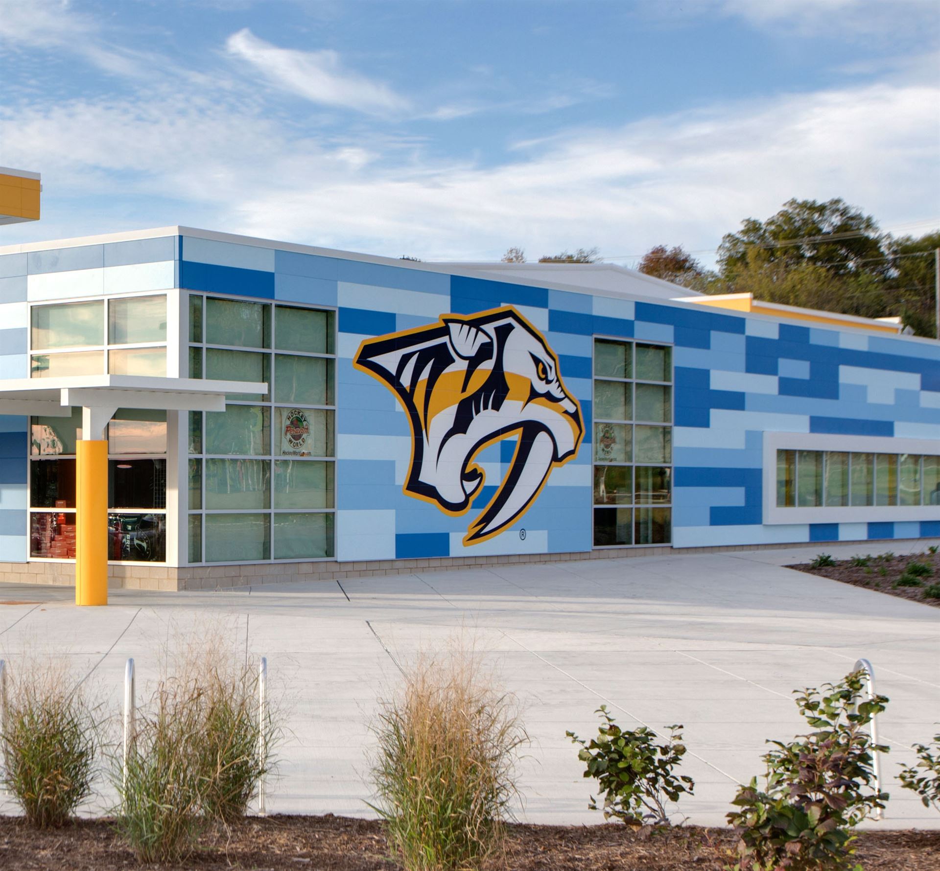 A community center in Nashville, TN has blue fiber cement panels with the hockey team&rsquo;s mascot on the building.
